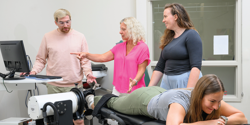 Karin Silbernagel, PT, PhD, FAPTA, works with two PT students.